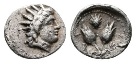 Caria, Rhodos. AR Diobol, 0.93 g 11.55 mm. Circa 275-250 BC. 
Obv:Radiate head of Helios to right. 
Rev: P - O Two rose buds; above, scallop shell. 
R...