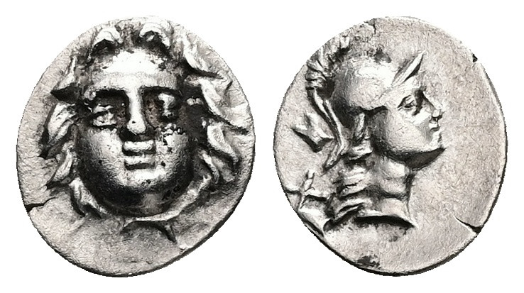 Pisidia, Selge, AR Obol, 0.75 g 11.58 mm. Circa 350-300 BC.
Obv: Facing gorgonei...