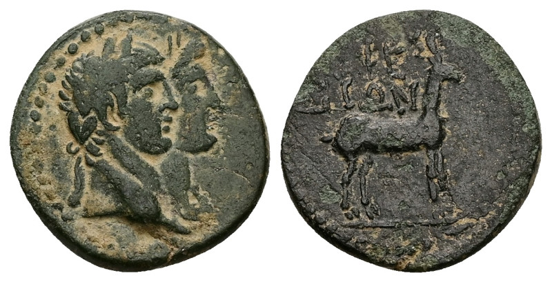 Ionia, Ephesus. Claudius, with Agrippina Junior, AD 41-54. AE. 3.80 g. 19.38 mm....