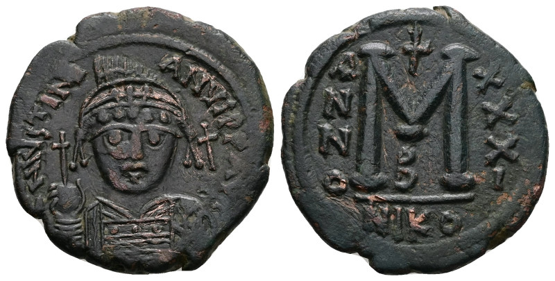 Justinian I, AD 527-565. AE, Follis. 16.94 g. 33.35 mm. Nicomedia.
Obv: DNIVSTIN...