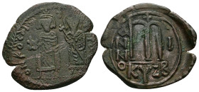 Phocas and Leontia, AD 602-610. AE, Follis. 12.15 g. 33.59 mm. Cyzicus.
Obv: DN FOCA [NЄ PЄ AV]. Phocas standing to left, crowned and holding globus c...