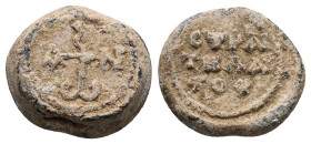 PB Byzantine seal of John, stratelates (AD 7th century) 
Obv: Cruciform monogram: Ἰωάννου. Wreath border.
Rev: Inscription of three lines: στρατηλάτου...
