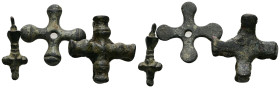 Three small bronze crosses.