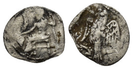 CILICIA, uncertain mint. AR Obol. (12mm, 0.49 g) 4th C. Baaltars seated left, holding grain ear, grape-bunch and sceptre Rev: Eagle standing left on p...