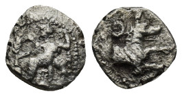 LYCAONIA, Laranda. Circa 324/3 BC. AR Obol (9mm, 0.49 g). Baaltars seated left, holding grain ear, grape bunch, and scepter / Forepart of wolf right; ...