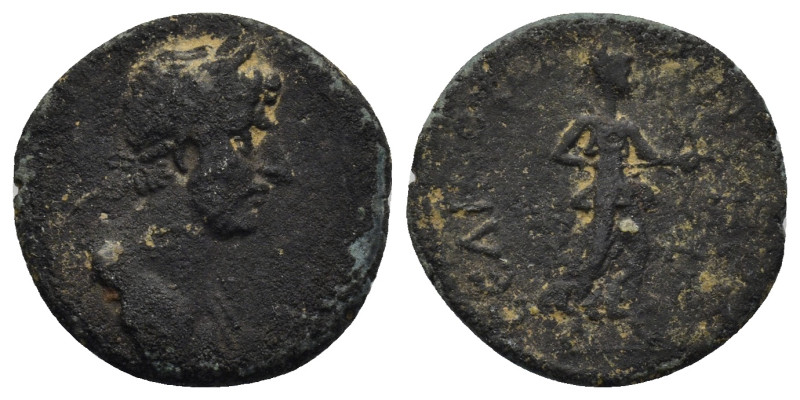 Hadrian AD 119-138. AE (2.86 Gr. 18mm.)
Laureate head to right 
 Rev. Apollo sta...