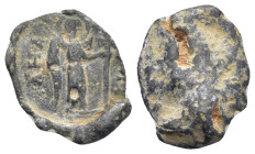 BYZANTINE LEAD SEALS. (18mm, 3.17 g) Obv: Victory standing left holding long cross Rev: Blank