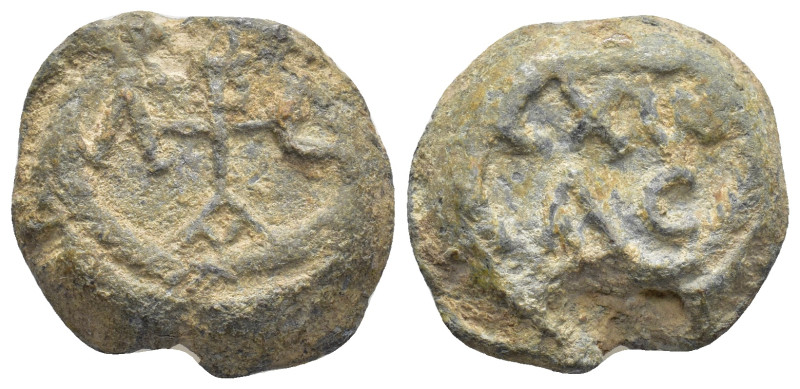 BYZANTINE LEAD SEALS. (21mm, 14.68 g) Obv: Cruciform monogram. Rev: Legend in tw...