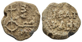 BYZANTINE LEAD SEALS. (21mm, 8.92 g) Obv: Cruciform monogram. Rev: Legend in two lines.