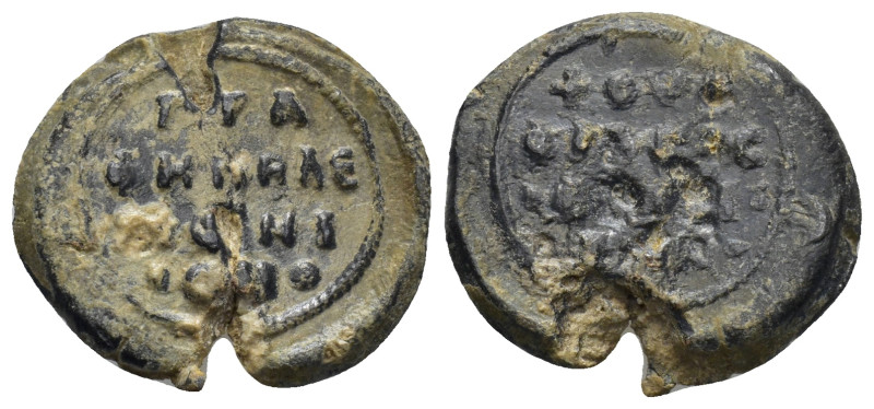 Byzantine lead seal (6.54 Gr. 21mm.) Obv: Legends in four lines. Rev: Legends in...