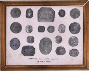Lot of (19) Die Impressions by John Adams Bolen Within a Frame.
Framed display of (19) white metal "Impressions from Paper Mill Dies," as written on ...