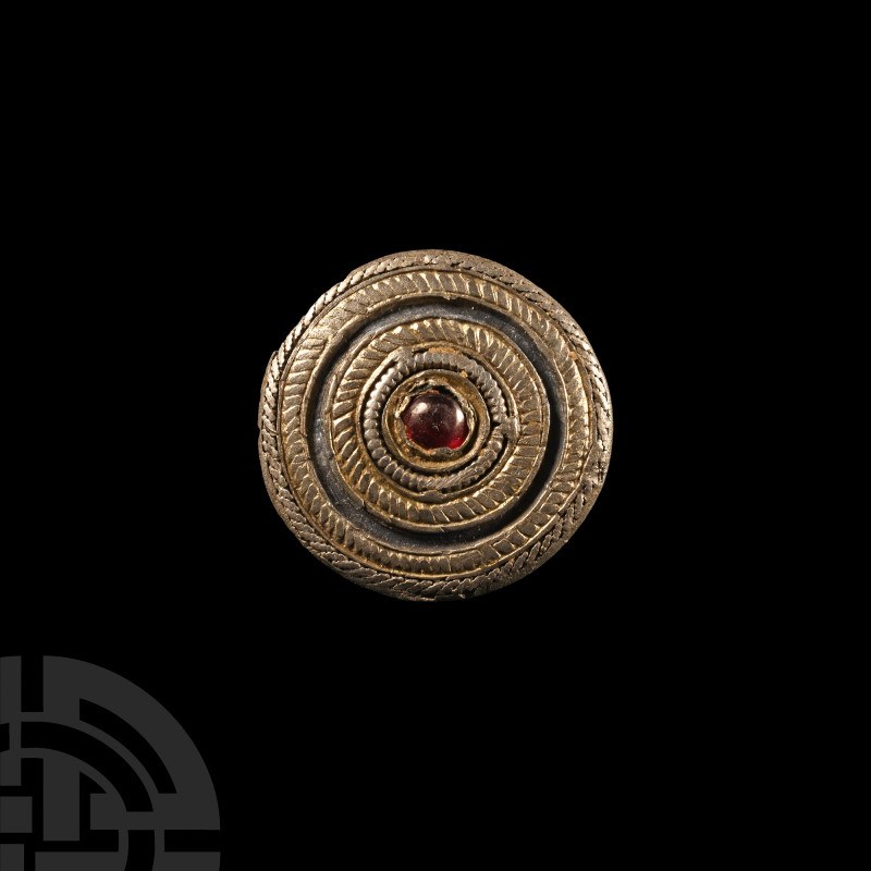 Roman Silver-Gilt and Garnet Disc Brooch
Circa 2nd century A.D.. Displaying con...