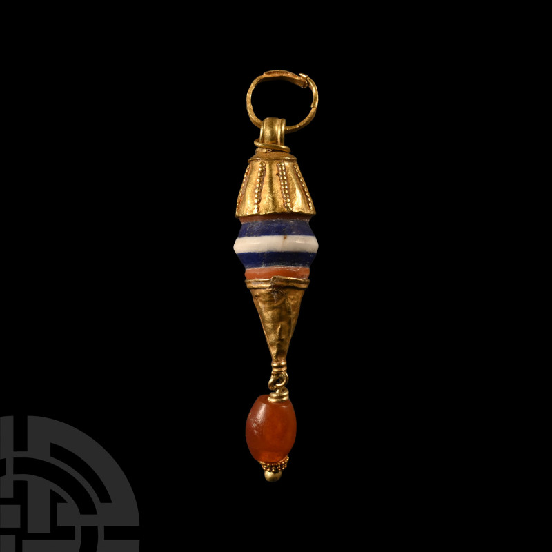 Greek Gold and Bead Pendant
Circa 4th-3rd century B.C. Composed of a blue and w...