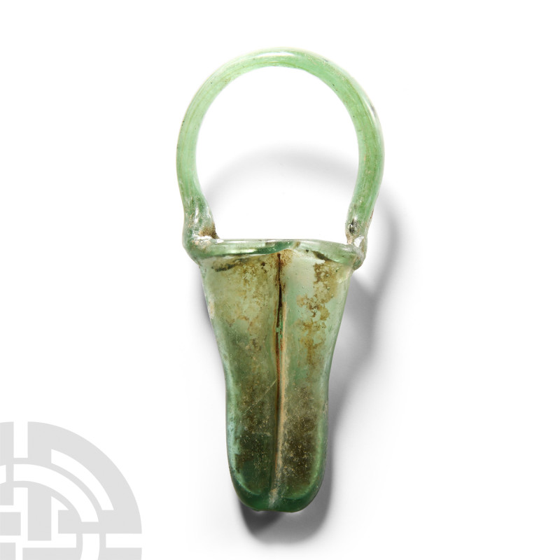 Roman Glass Double Unguentarium with Handle
1st-2nd century A.D. A green double...