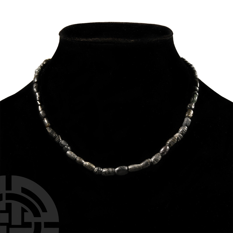 Roman Black Glass Bead Necklace String
1st-4th century A.D. Restrung; composed ...