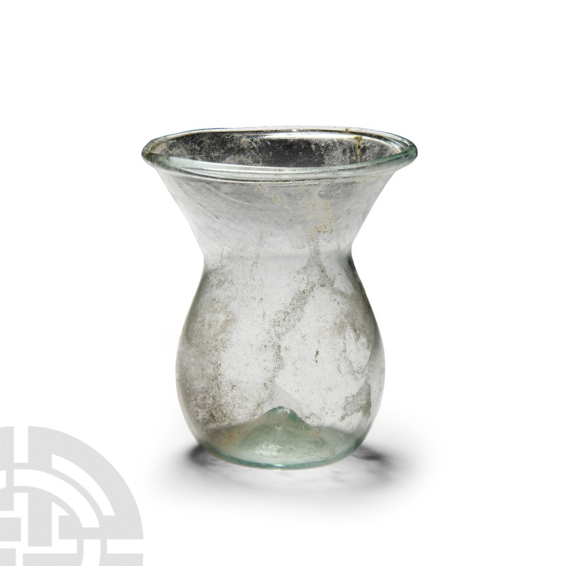 Roman Clear Glass Bottle
4th century A.D. With dimpled base and funicular neck....