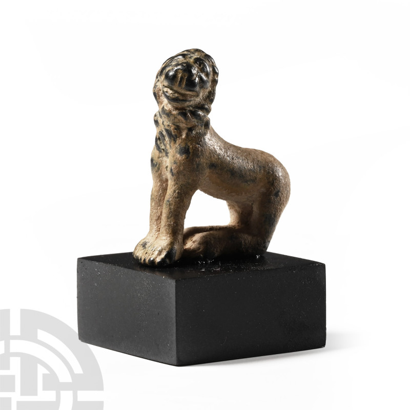 Roman Bronze Seated Lion Statuette
1st-4th century A.D. Modelled in the round w...