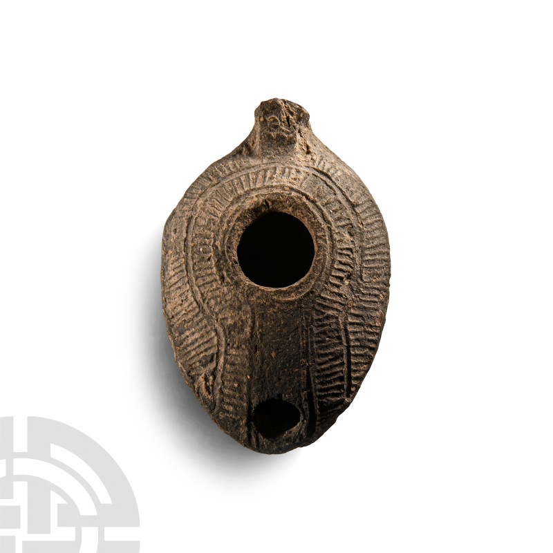 Byzantine Terracotta Oil Lamp
7th century A.D. Carinated with a domed upper fac...