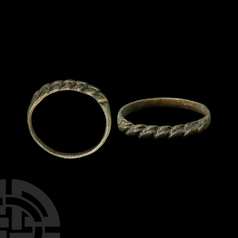 Viking Age Bronze Faux Plaited Ring
Circa 9th-11th century A.D. The slender hoo...