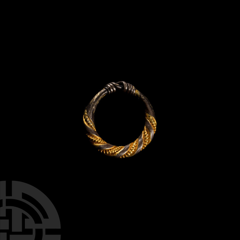 Viking Age Silver-Gilt Twisted Ring
9th-11th century A.D. Composed of a round-s...