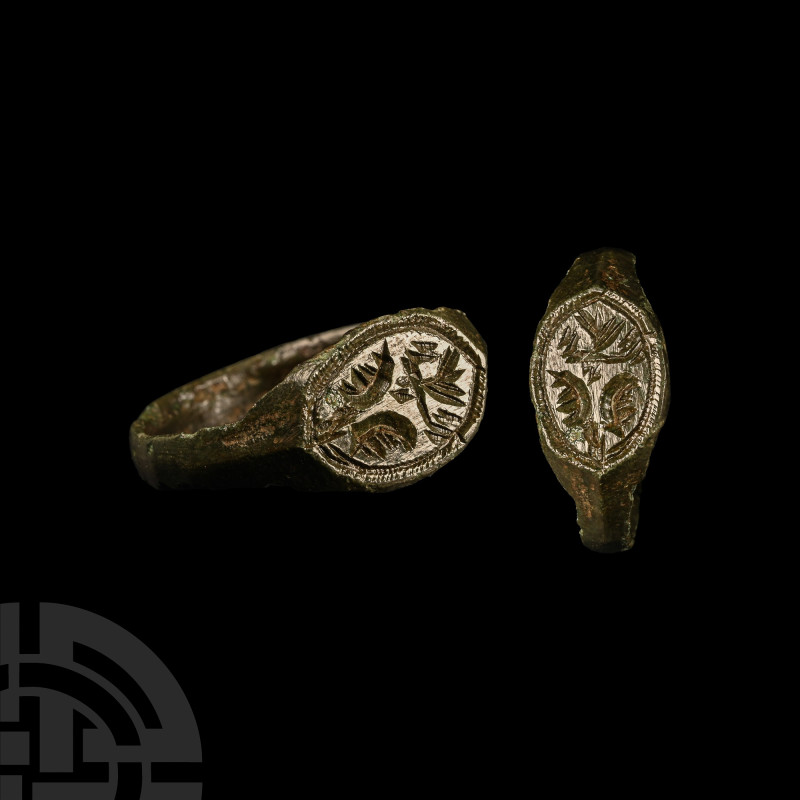 Medieval Bronze Ring with Foliage
15th-16th century A.D. The slender hoop expan...