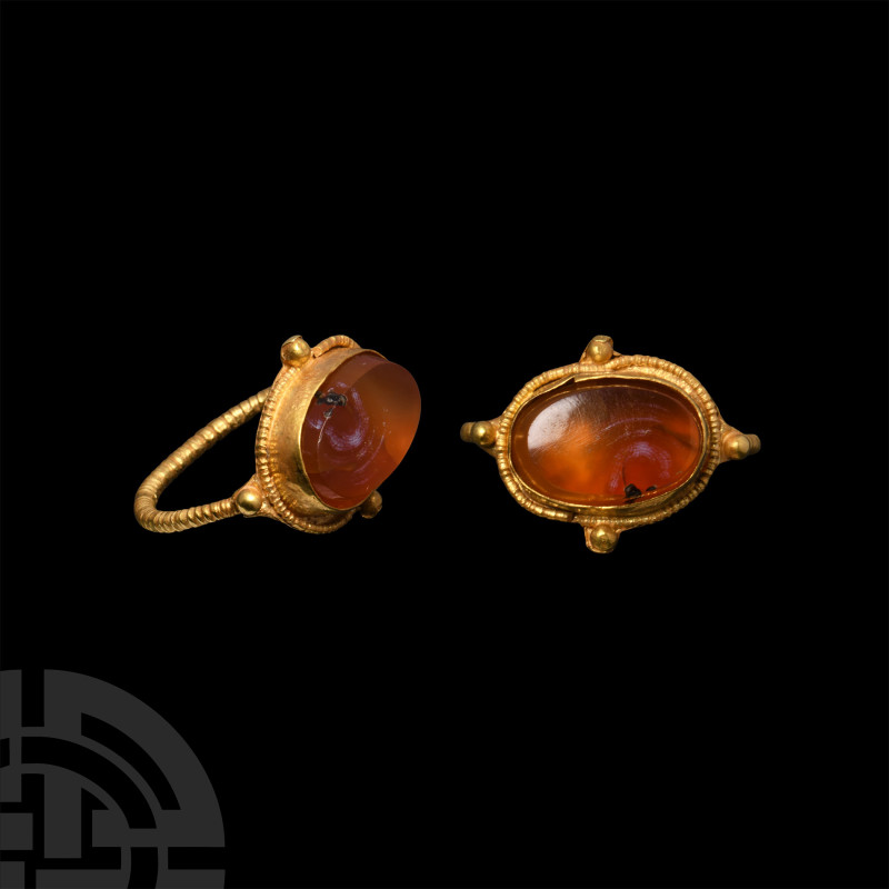 Gold Ring with Carnelian Gemstone
20th century A.D. or earlier. Composed of a s...