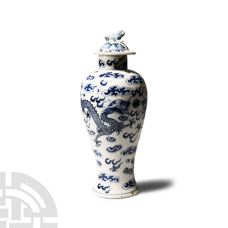 Chinese Blue and White Dragon Jar
20th century A.D. Piriform with splayed foot,...