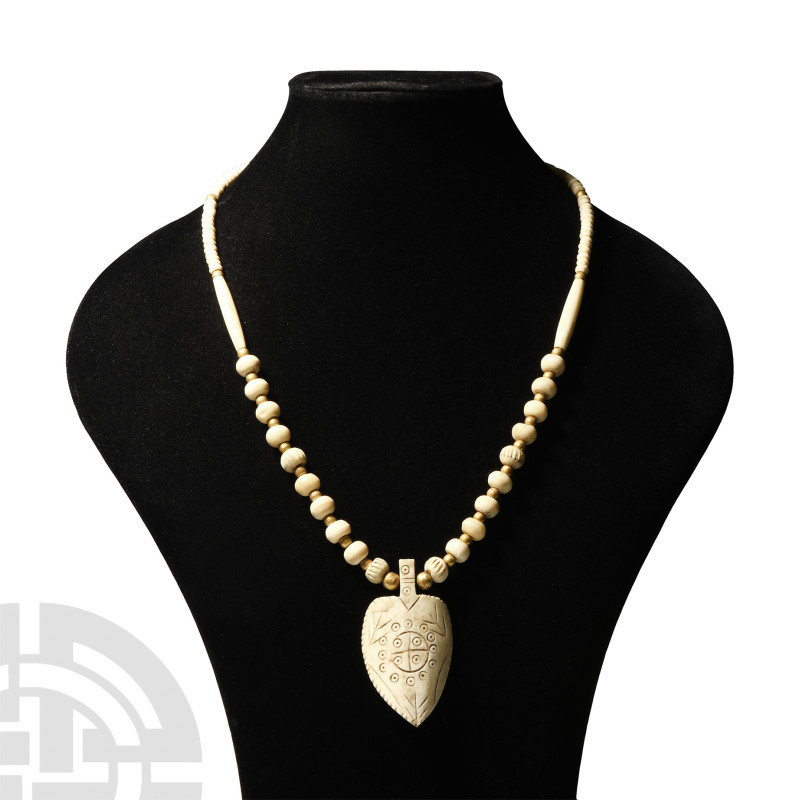 Indian Bone Bead Necklace with Pendant
20th century A.D. A restrung bone bead n...