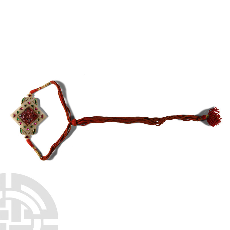 Indian Stone Pendant with Glass and Ruby Inlays
20th century A.D. Lozenge-shape...