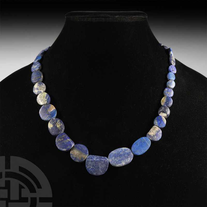 Lapis Lazuli Bead Necklace
20th century A.D. Composed of graduated coin-shaped ...