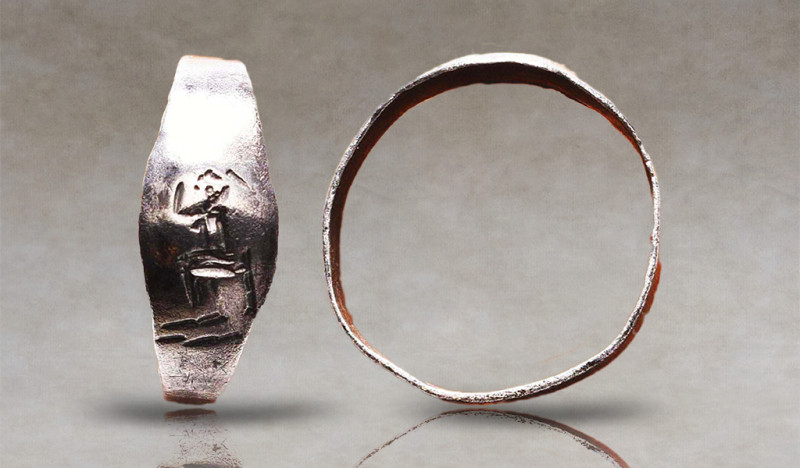 Greek Silver Ring with Seated Goddess, 5th-3rd century B.C. A silver ring compos...