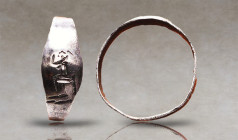 Greek Silver Ring with Seated Goddess, 5th-3rd century B.C. A silver ring composed of a Round section hoop engraved with a goddess seated Left. Refere...