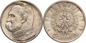 II RP. 2 zlote 1936 Pilsudski 
Znikomy nakład monety (zaledwie 75000 egzemplarzy) w połączeniu z zawirowaniami okresu wojennego powoduje, że numizmat...