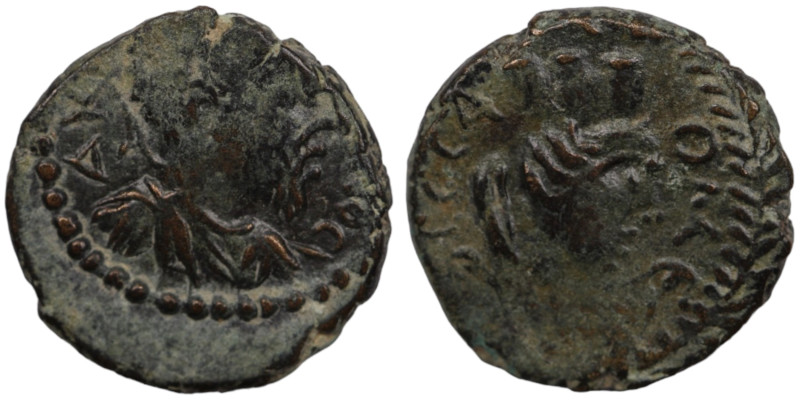 Caracalla. (198-217 AD). Æ Bronze. (18mm, 3,87g) Mesopotamia. Carrhae. Obv: laur...