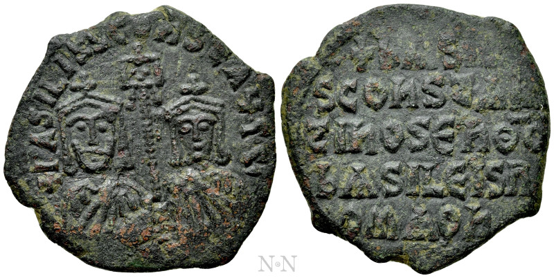 BASIL I THE MACEDONIAN with CONSTANTINE (867-886). Follis. Constantinople (or un...