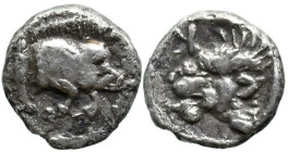 Greek
MYSIA, Kyzikos (Circa 450-400 BC)
AR Hemiobol (7mm 0.3g)
Obv: Forepart of boar right; to left, tunny upward.
Rev: Head of lion left; retrogr...