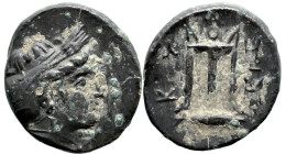 Greek
MYSIA. Kyzikos. (circa 350-300 BC)
AE Bronze (13mm 1.61g)
Obv: Head of Kore Soteira right, hair bound in sakkos
Rev: KY-ZI, tripod, monogram...