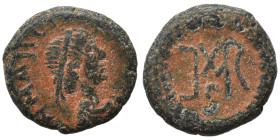 Marcian, 450-457. Nummus (bronze, 1.07 g, 10 mm), Nicomedia. D N MARCIANVS P F AV Diademed, draped and cuirassed bust right. Rev. Monogram in wreath. ...