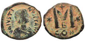 Justin I, 518-527. Follis (bronze, 9.57 g, 30 mm), Eastern imitation. Diademed, draped, and cuirassed bust right. Rev. Large M; cross above, star to l...