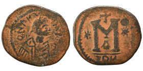 Justin I, 518-527. Follis (bronze, 11.56 g, 34 mm), Eastern imitation. Diademed, draped, and cuirassed bust right. Rev. Large M; cross above, star to ...