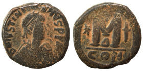 Justinian I, 527-565. Follis (bronze, 15.52 g, 28 mm), Constantinople. Diademed, draped, and cuirassed bust right; star on shoulder. Rev. Large M; cro...