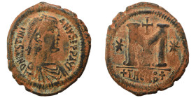 Justinian I, 527-565. Follis (bronze, 13.33 g, 33 mm), Theoupolis (Antioch). Pearl-diademed, draped, and cuirassed bust right. Rev. Large M; cross abo...