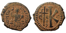 Justinian I, 527-565. Half follis (bronze, 11.65 g, 27 mm), Theoupolis (Antioch). DN IVSTINIANVS PP AVG Justinian seated facing, holding long scepter ...