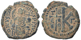 Justinian I, 527-565. Half follis (bronze, 9.91 g, 26 mm), Theoupolis (Antioch). DN IVSTINIANVS PP AVG Justinian seated facing, holding long scepter a...