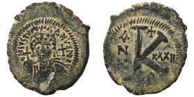 Justinian I, 527-565. Half Follis (bronze, 9.81 g, 28 mm), Theoupolis (Antioch). Helmeted and cuirassed bust facing, holding globus cruciger and shiel...