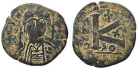 Justinian I, 527-565. Follis (bronze, 12.19 g, 27 mm), Carthage. D N IVSTINIANVS P P AVI Helmeted and cuirassed bust of Justinian I facing, holding gl...