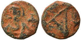 Justin II, 565-578. Nummus (bronze, 0.45 g, 7 mm), Carthage. Nimbate bust facing between two crosses. Rev. Large Δ (or A) with stars around. DOC 310 (...