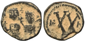 Phocas, with Leontia, 602-610. Half Follis (bronze, 3.84 g, 20 mm), uncertain northern Syrian mint, struck 615/616 under Persian rule. Phocas, holding...