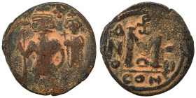 Heraclius, with Heraclius Constantine, 610-641. Follis (bronze, 3.14 g, 21 mm), uncertain mint, Arab-Byzantine imitation of Heraclius follis. Crowned ...
