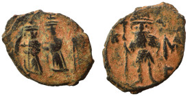 Constans II, with Constantine IV, Heraclius, and Tiberius, 641-668. Follis (bronze, 3.12 g, 21 mm), Constantinople. Constans II standing facing, in mi...